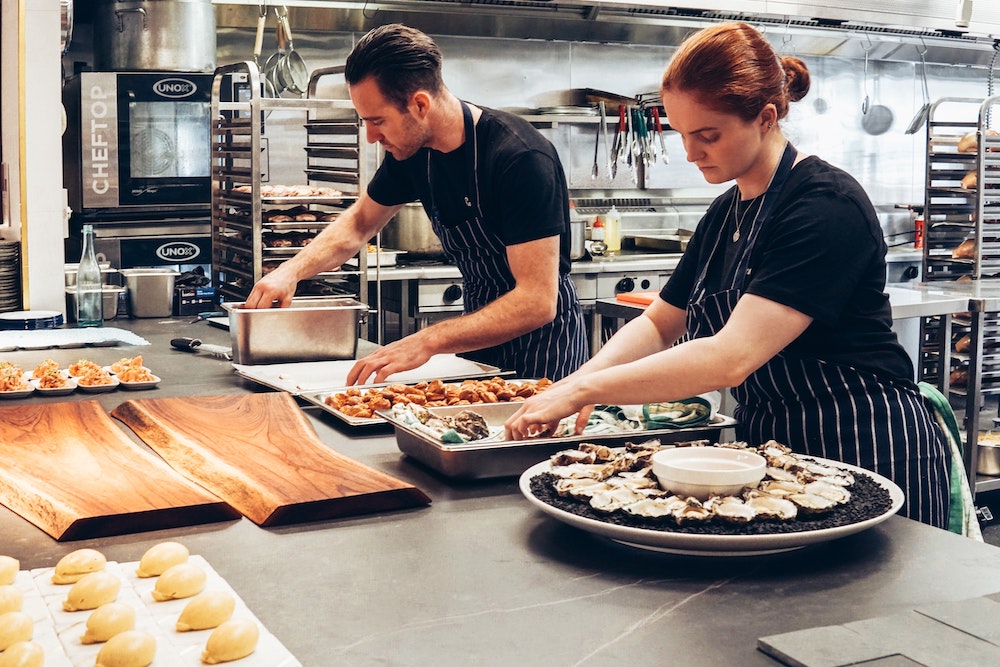Catering staff assembling food
