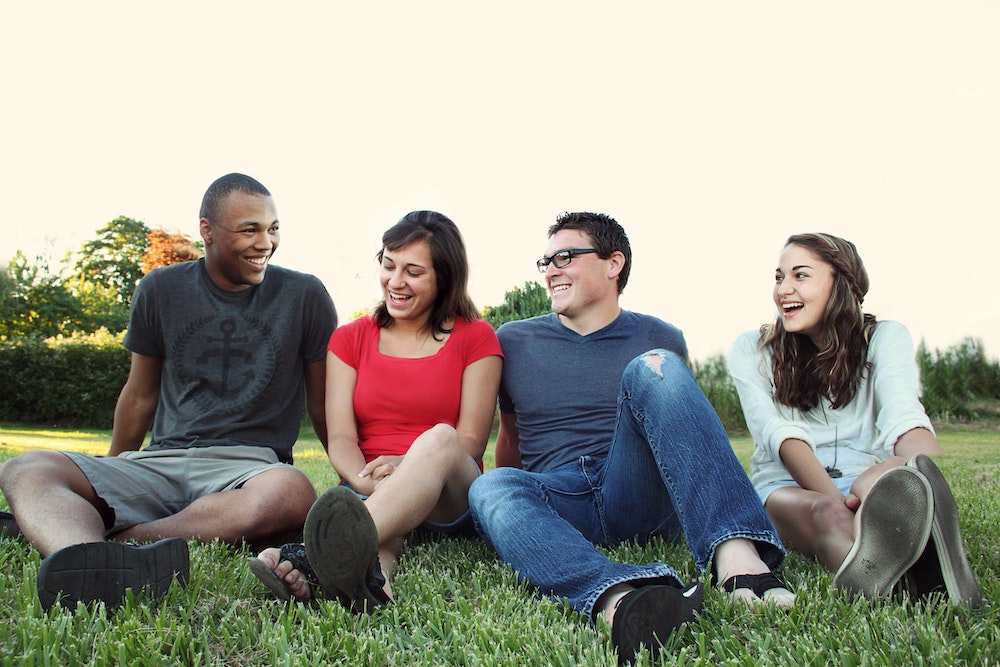 Group of Students Sitting on the Grass