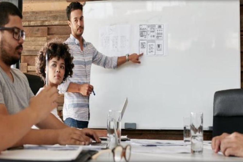 stock photo of young people in a planning meeting